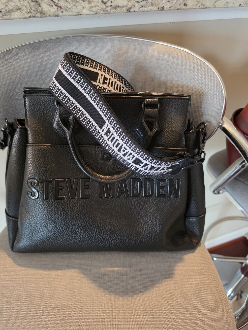 Steve Madden Black Pebbled Messenger Bag with Woven Strap- Gently Used.